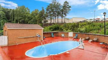Seasonal outdoor pool, open 10 AM to 10 PM, pool umbrellas