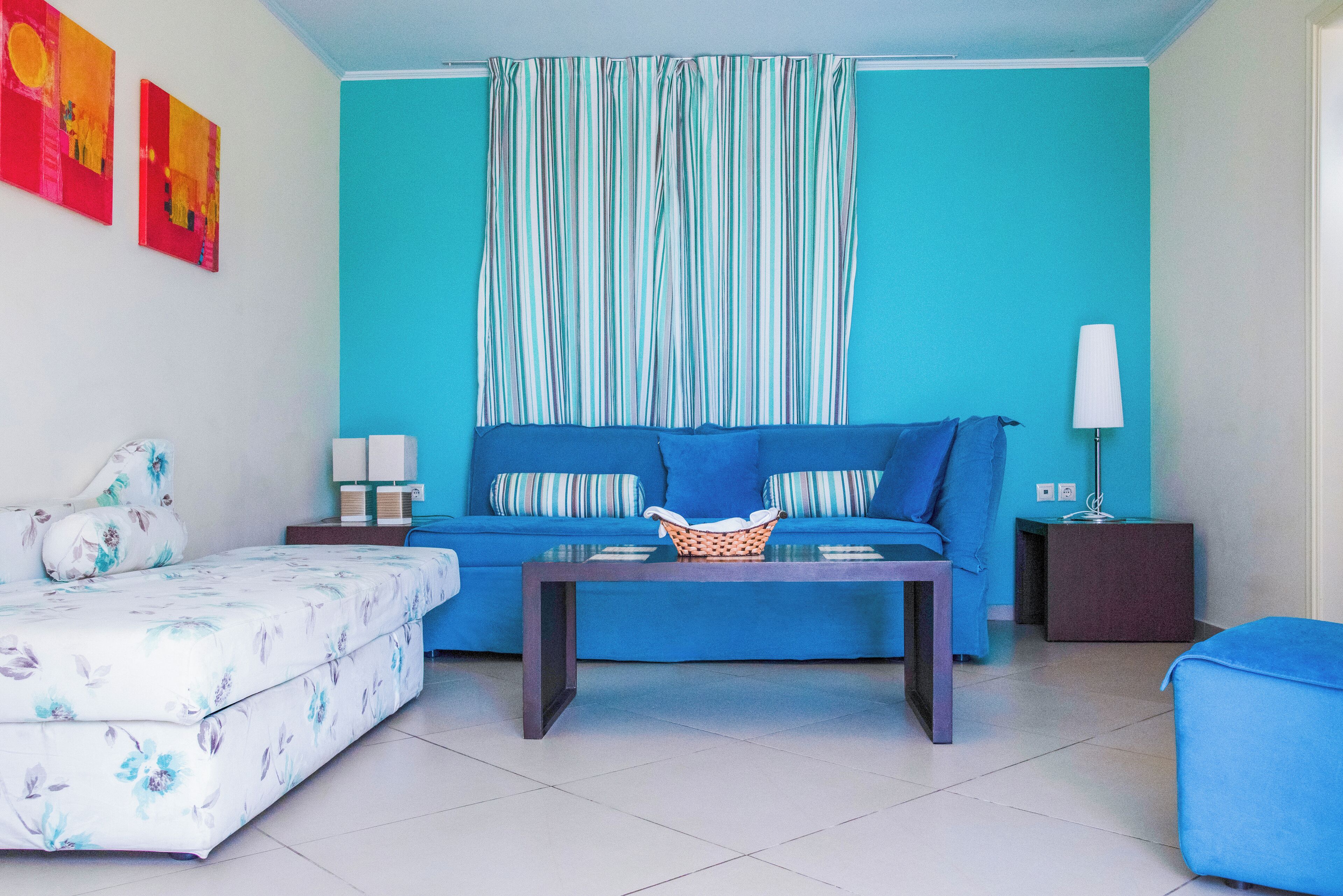 A living room with a sofa, a coffee table, and a side table.