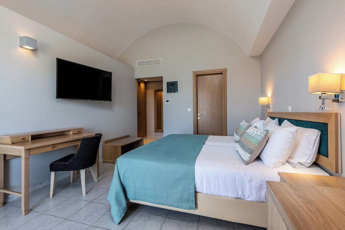 Double Room Garden View | Resort Area | In-room safe, desk, free WiFi, bed sheets
