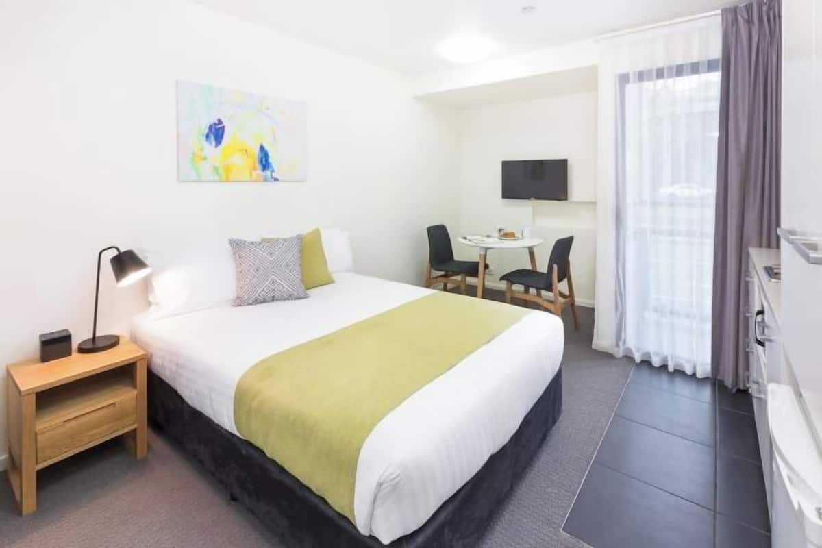 Premium bedding, desk, blackout drapes, iron/ironing board