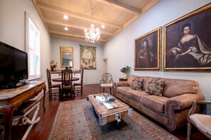 Audubon Cottage 2 | Living area | 42-inch flat-screen TV with cable channels, TV, iPod dock - Audubon Cottages (New Orleans)