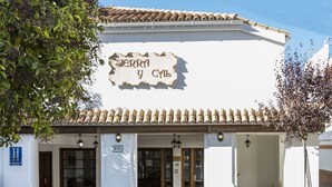 A building with a sign reading "Sierra y Cal" and a tiled roof. - TUGASA Sierra Y Cal (Olvera)