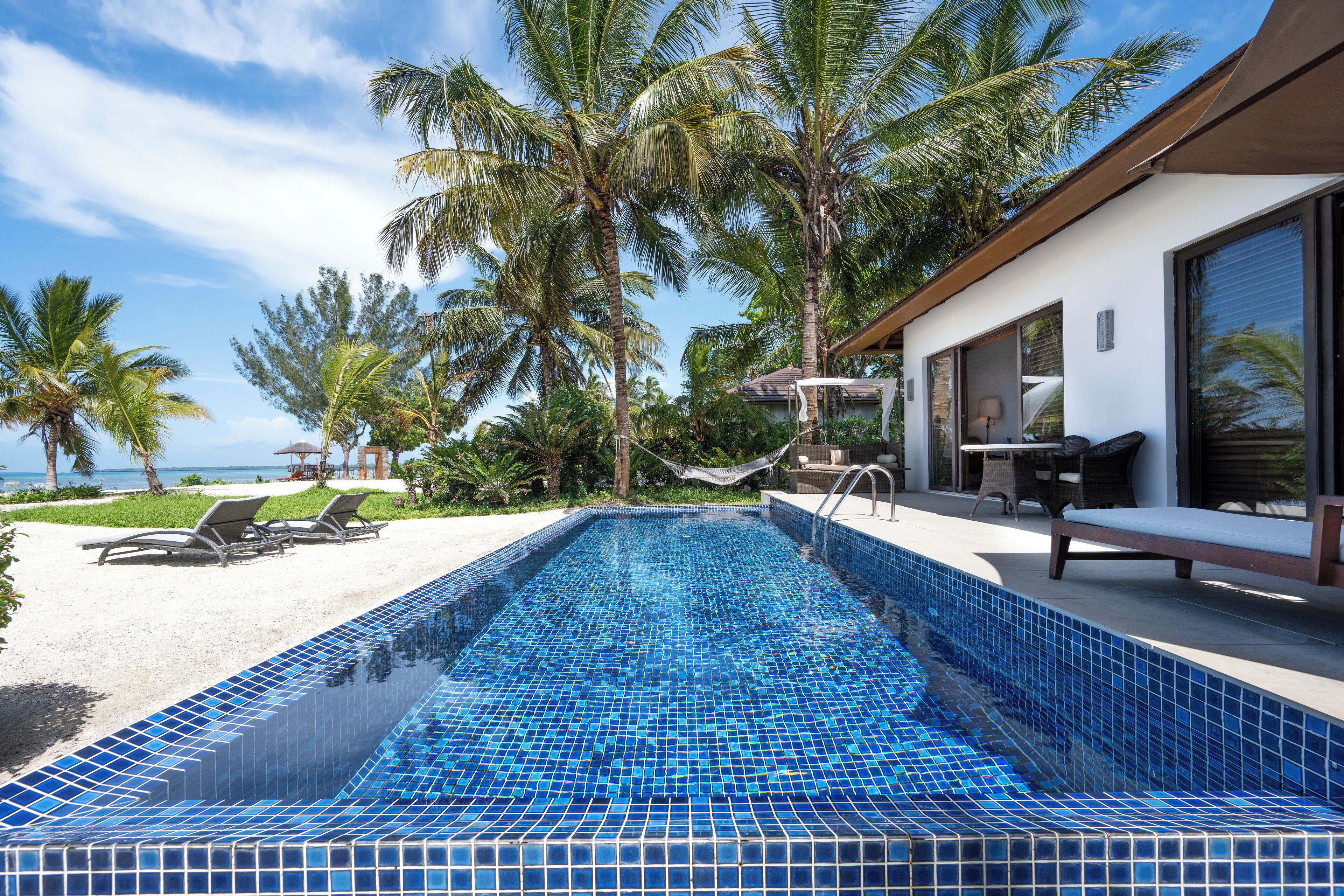 luxury ocean front pool villa | minibar, in-room safe, desk, blackout curtains