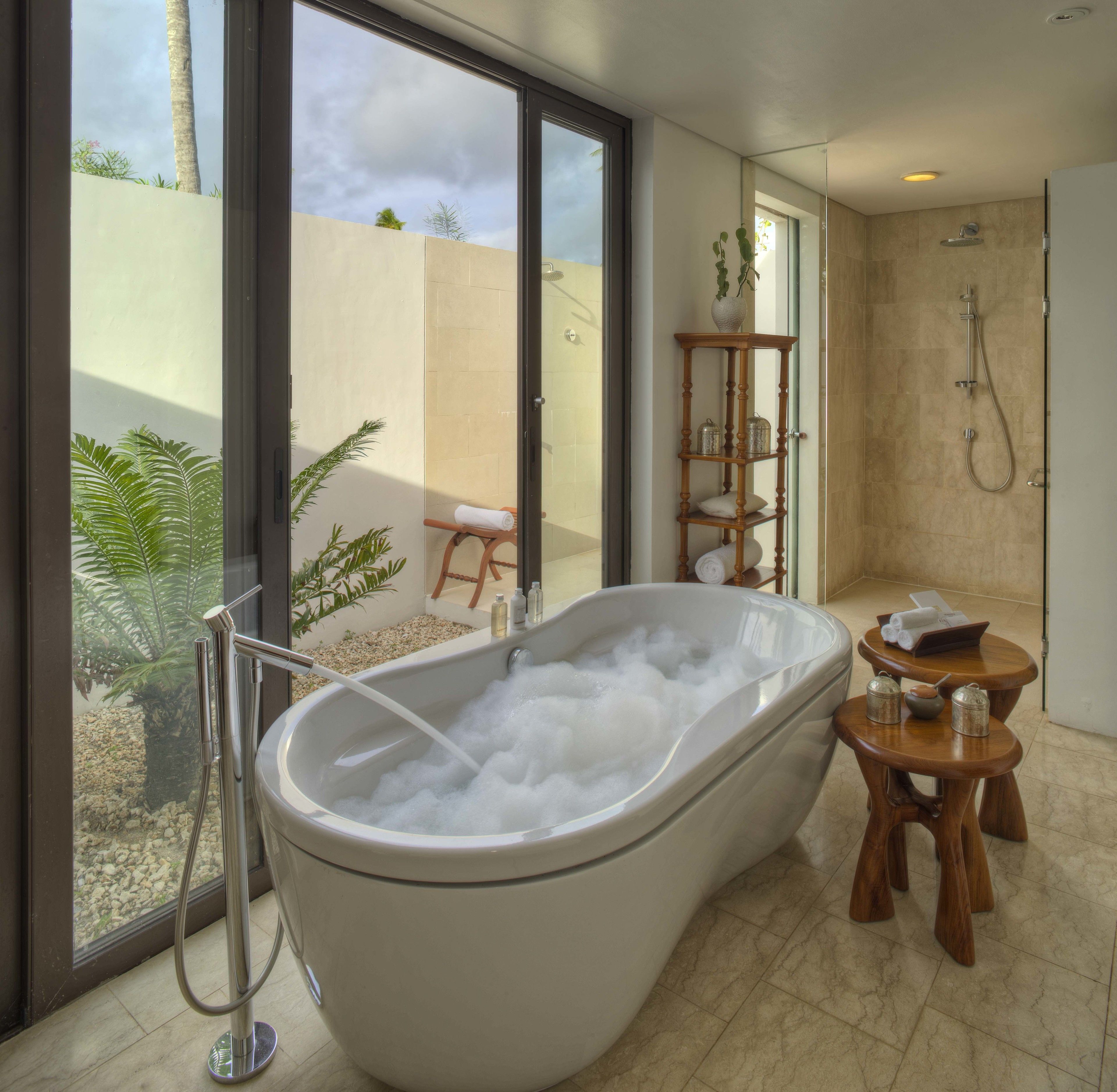 luxury garden pool villa | bathroom | separate bathtub and shower, free toiletries, hair dryer, slippers