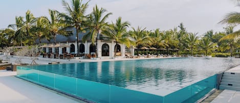 Outdoor pool, pool umbrellas, sun loungers