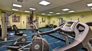 A gym with Nautilus elliptical machines, a treadmill, and weight equipment. - Holiday Inn Express & Suites Wichita Northwest by IHG (Maize)