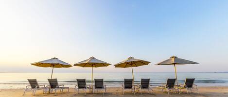 Private beach, white sand, sun loungers, beach umbrellas