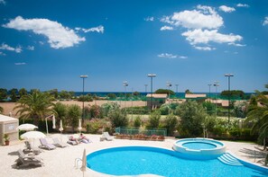 Seasonal outdoor pool, pool umbrellas, pool loungers