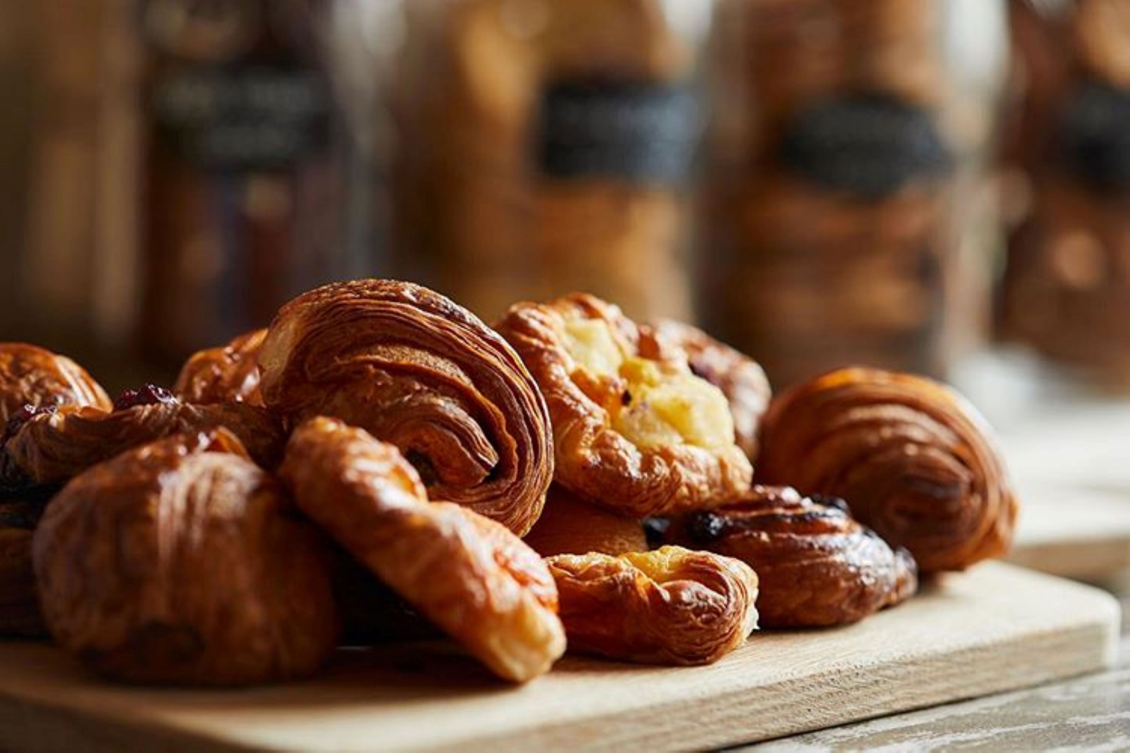 A variety of pastries on a wooden board.