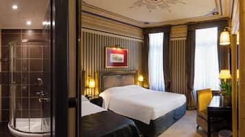 Triple Room | Pillowtop beds, free minibar items, in-room safe, individually decorated