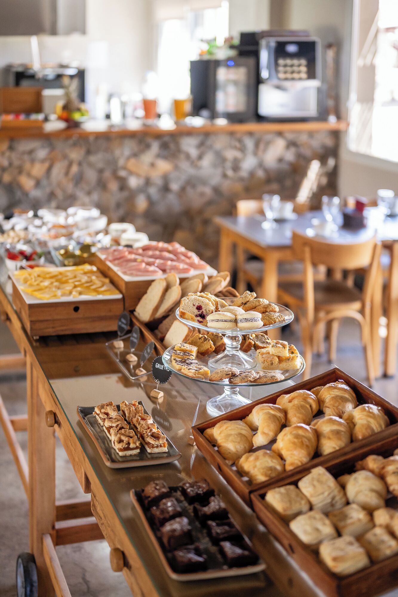 A buffet with various pastries and desserts.