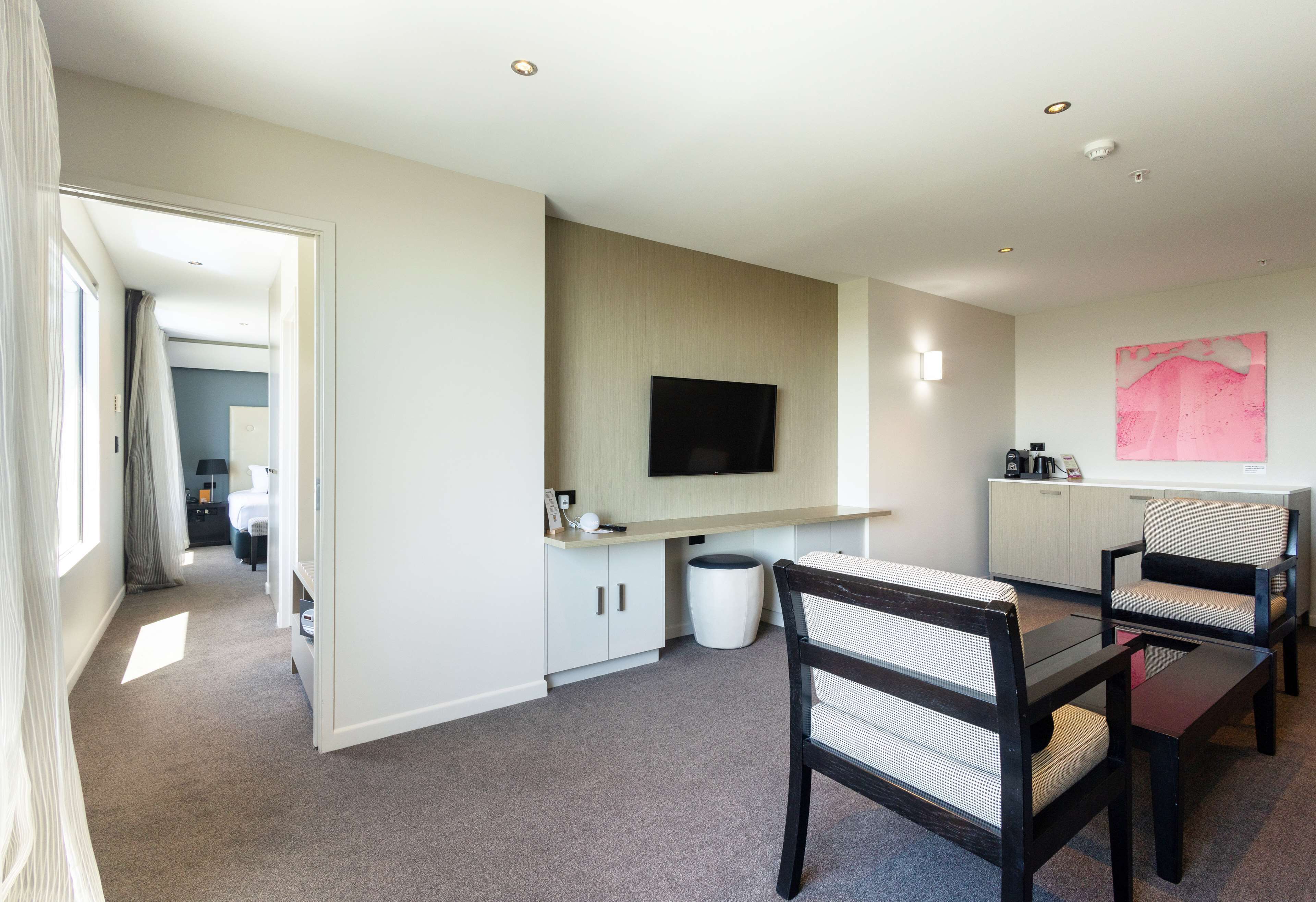 premium suite | 1 bedroom, in-room safe, laptop workspace, blackout curtains