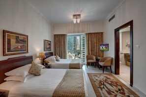 In-room safe, desk, laptop workspace, blackout drapes - Marina Hotel Apartments (Dubai)