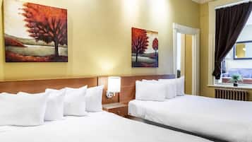 Economy Plus Room | 1 bedroom, desk, blackout drapes, iron/ironing board