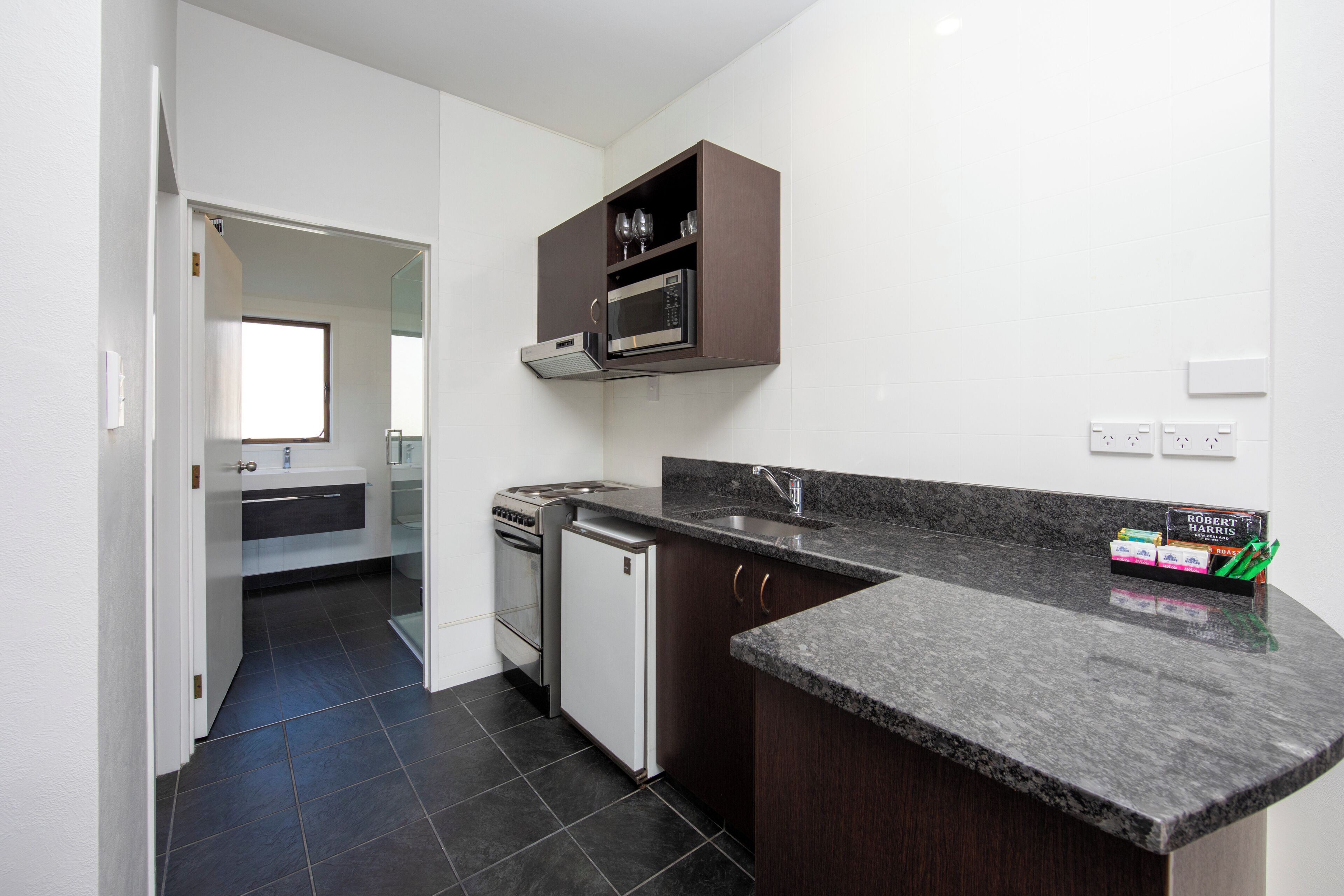 Suite, 1 Bedroom | Private kitchen | Fridge, microwave, coffee/tea maker, electric kettle