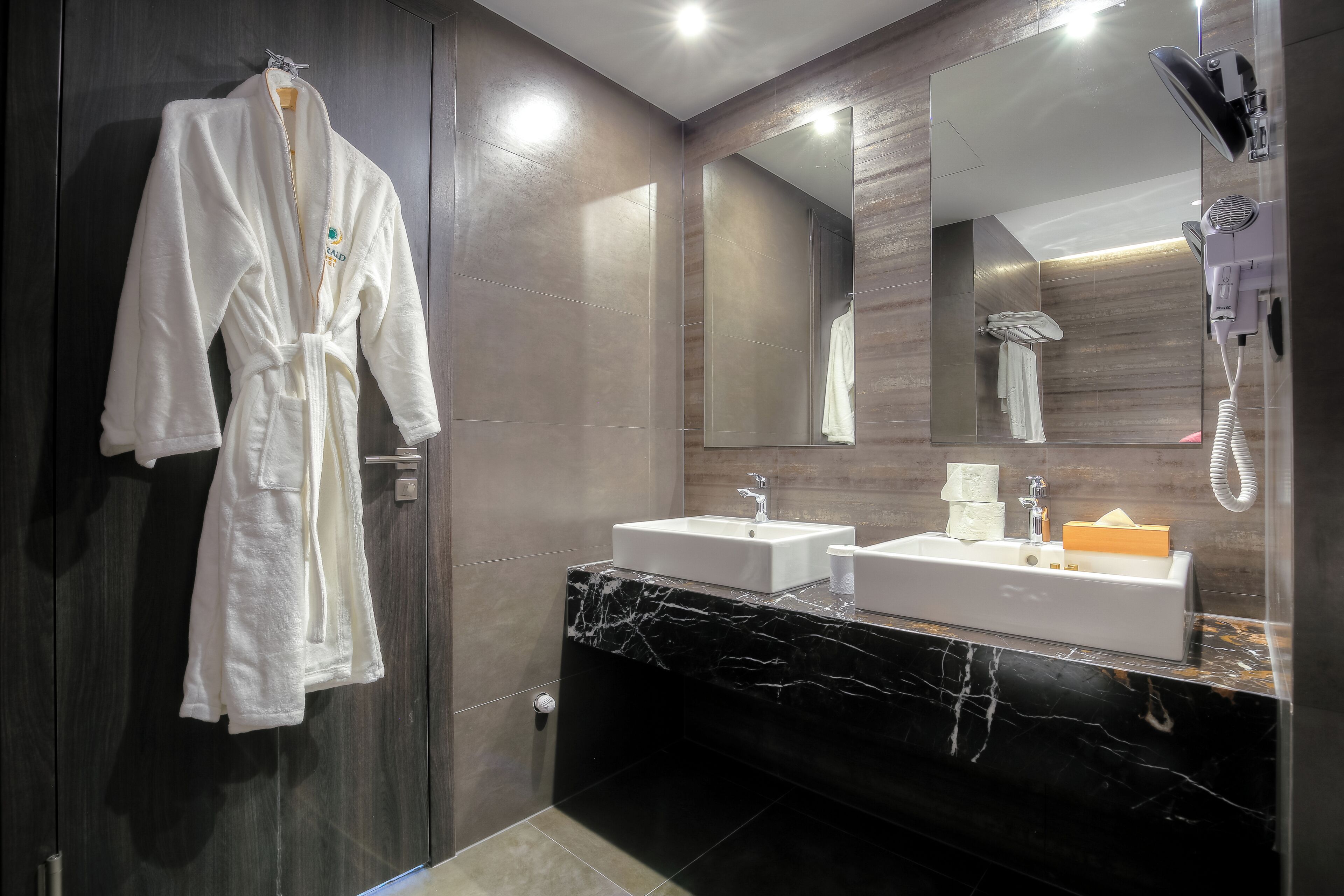 deluxe suite | bathroom | designer toiletries, hair dryer, bathrobes, slippers