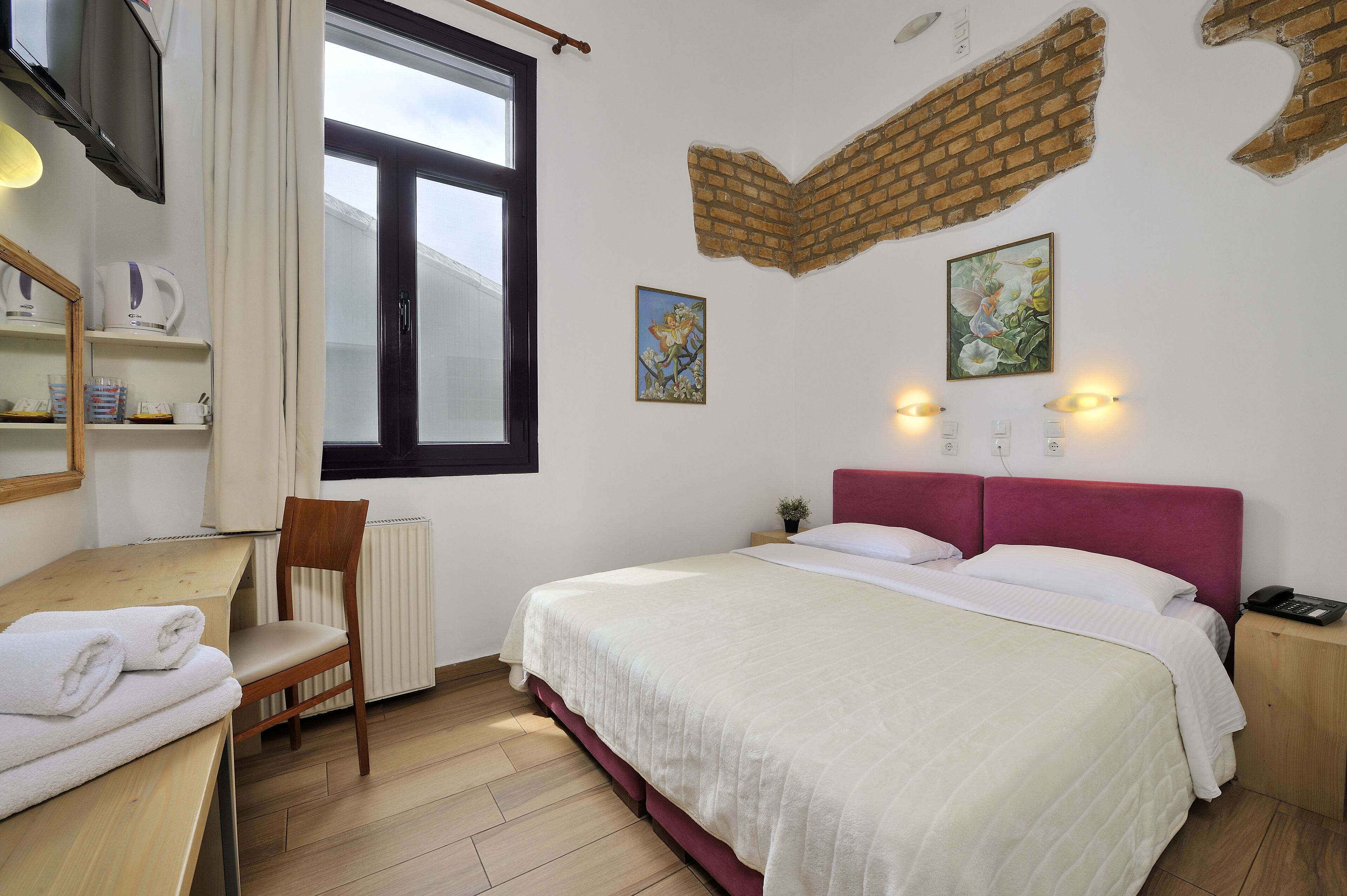 economy double room, patio, ground floor | 1 bedroom, down duvets, pillow-top beds, in-room safe