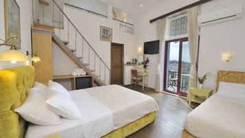 Acropolis Family Room | Down comforters, pillowtop beds, in-room safe, desk