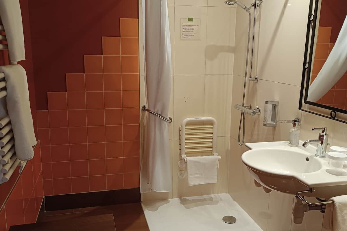 classic double room | bathroom | shower, hair dryer, towels