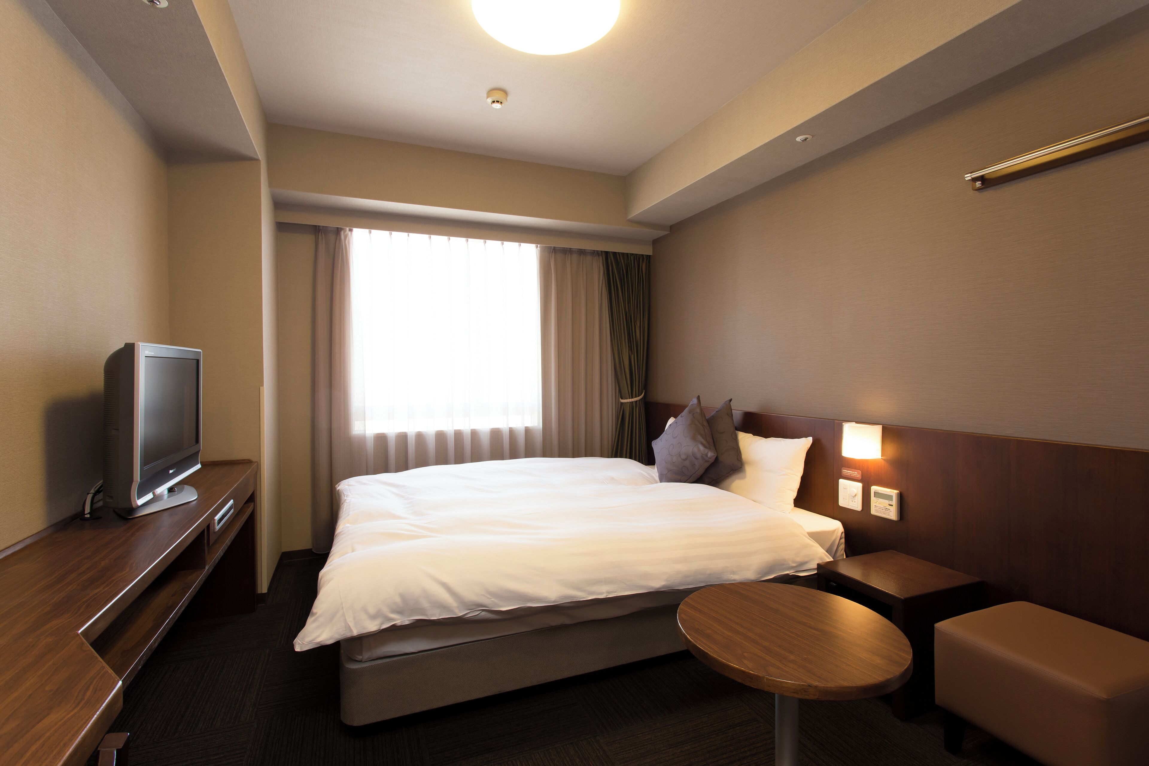 Premium bedding, down comforters, blackout drapes, iron/ironing board