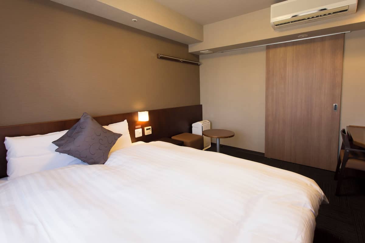 Premium bedding, down duvets, blackout curtains, iron/ironing board