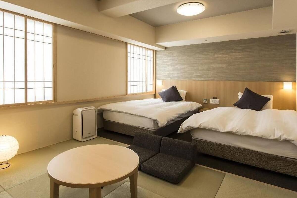 Premium bedding, down duvets, blackout curtains, iron/ironing board