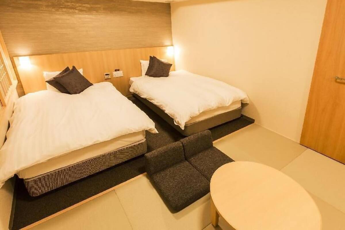 Premium bedding, down duvets, blackout curtains, iron/ironing board