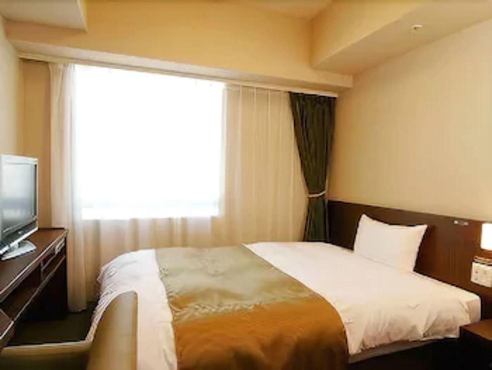 Premium bedding, down duvets, blackout curtains, iron/ironing board