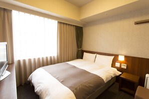 Premium bedding, down duvets, blackout curtains, iron/ironing board