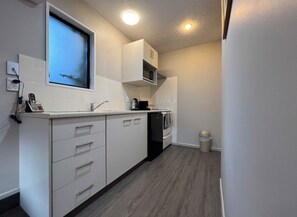 Premium Room, 2 Bedrooms | Private kitchen | Microwave, coffee/tea maker, electric kettle