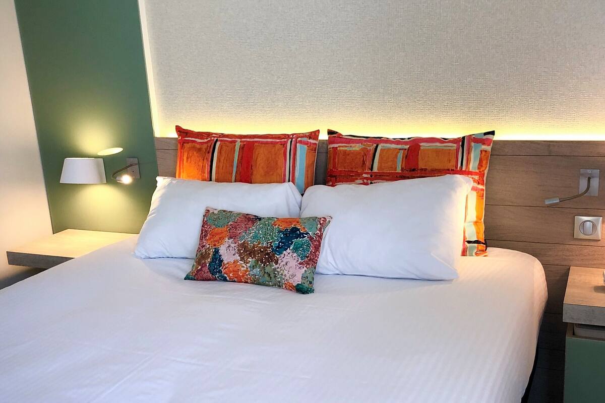 Premium bedding, desk, laptop workspace, soundproofing