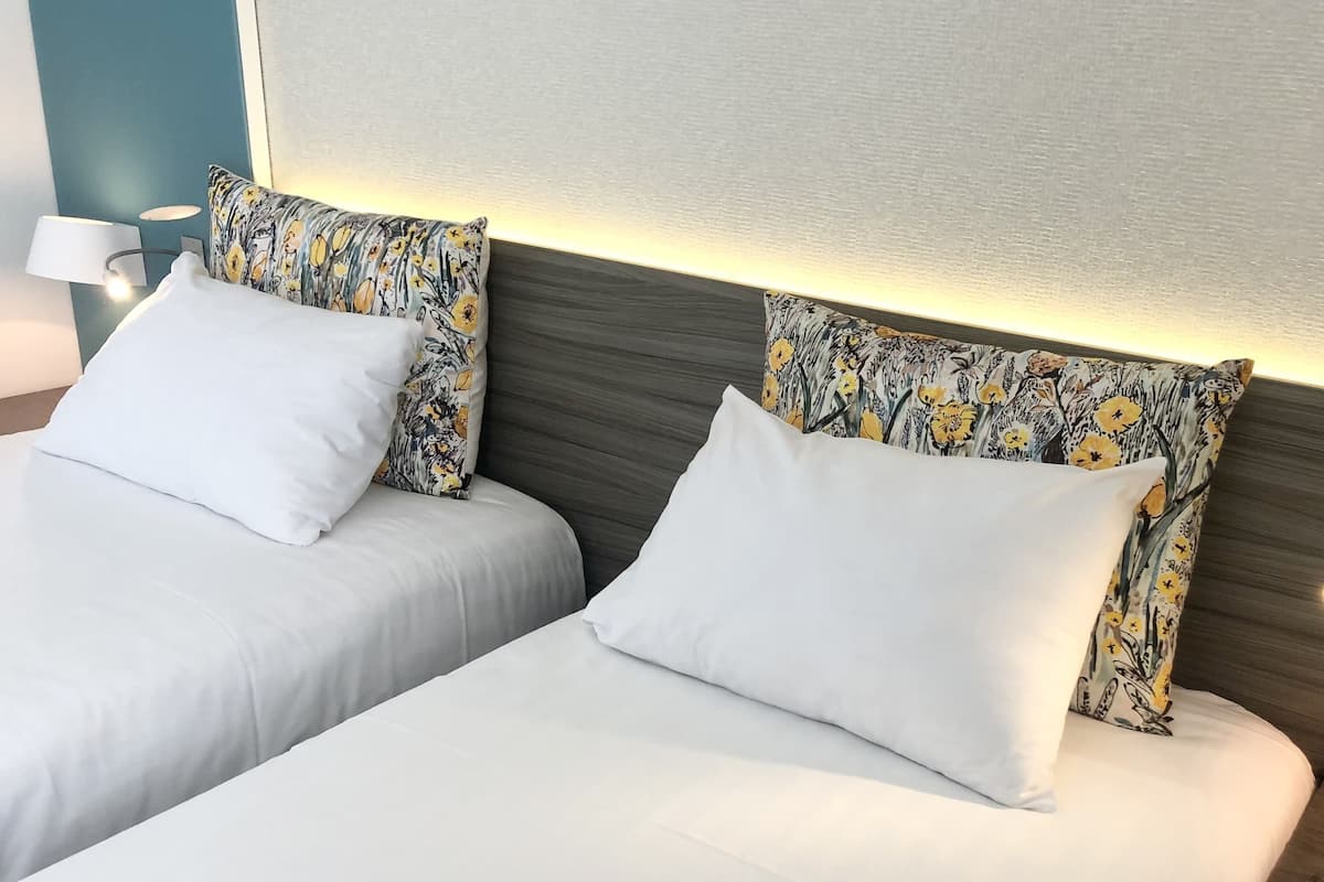 classic twin room | premium bedding, individually furnished, desk, laptop workspace