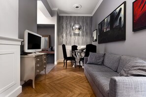 Junior Suite, 1 Bedroom, Balcony | Living area | 25-inch TV with digital channels