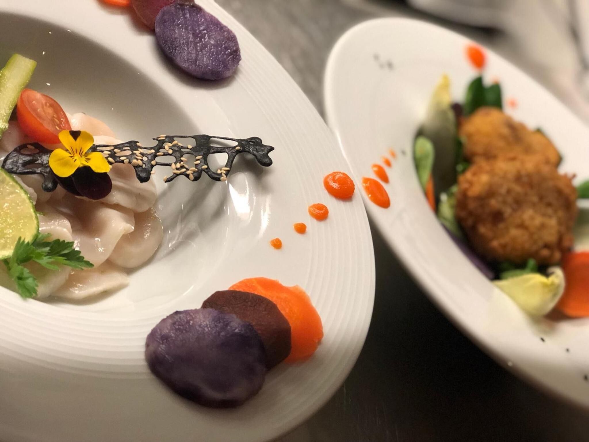A plate of food with various garnishes and a decorative element.