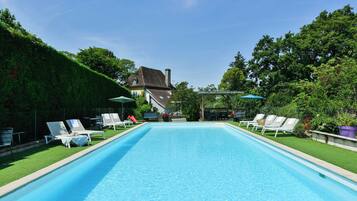 Outdoor pool, open 10 AM to 7 PM, pool loungers