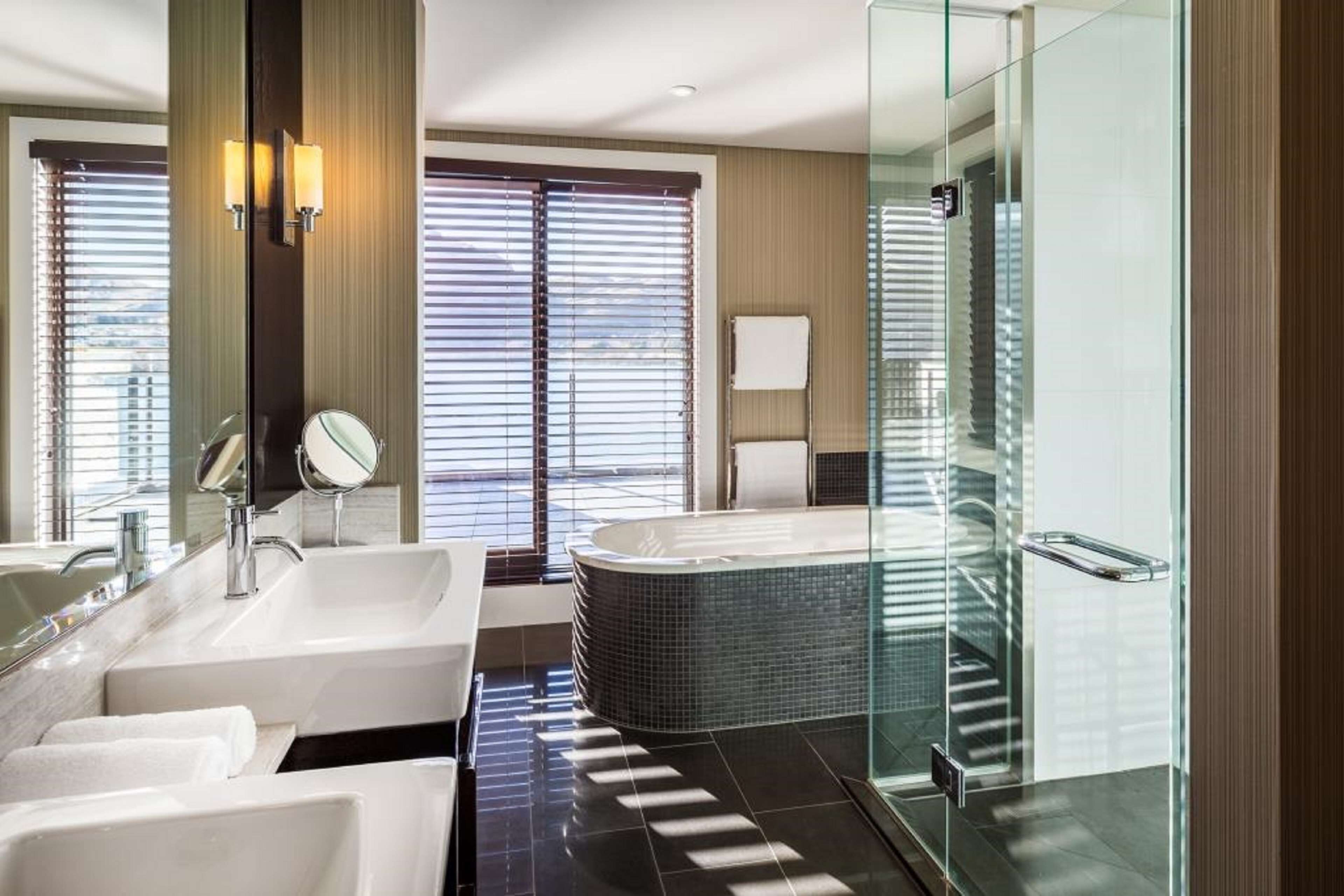 deluxe room, 1 king bed (plus) | bathroom | shower, rainfall showerhead, designer toiletries, hair dryer