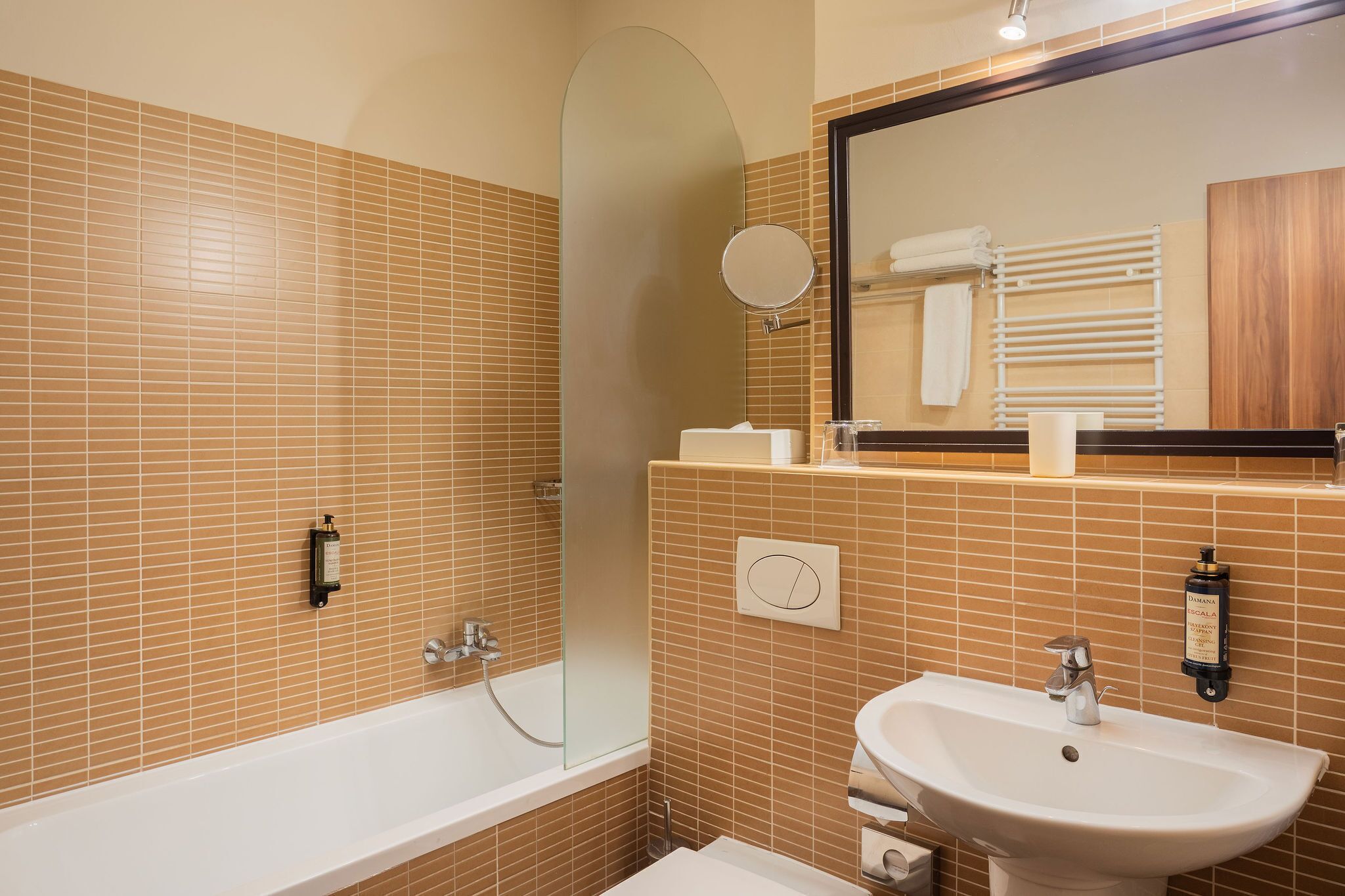 combined shower/bathtub, designer toiletries, hair dryer, towels