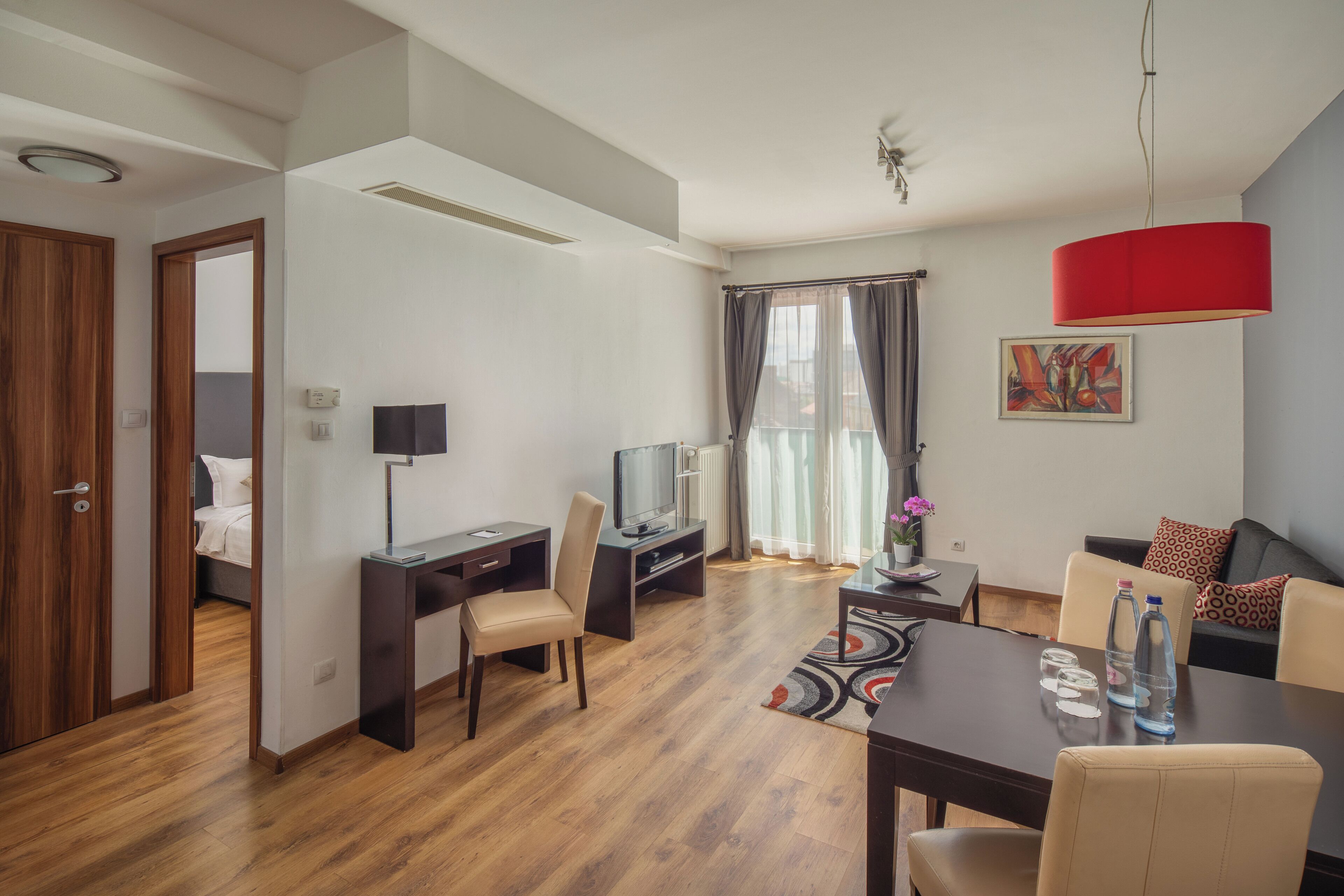 deluxe suite, 1 bedroom | living area | 82-cm lcd tv with satellite channels, tv, dvd player