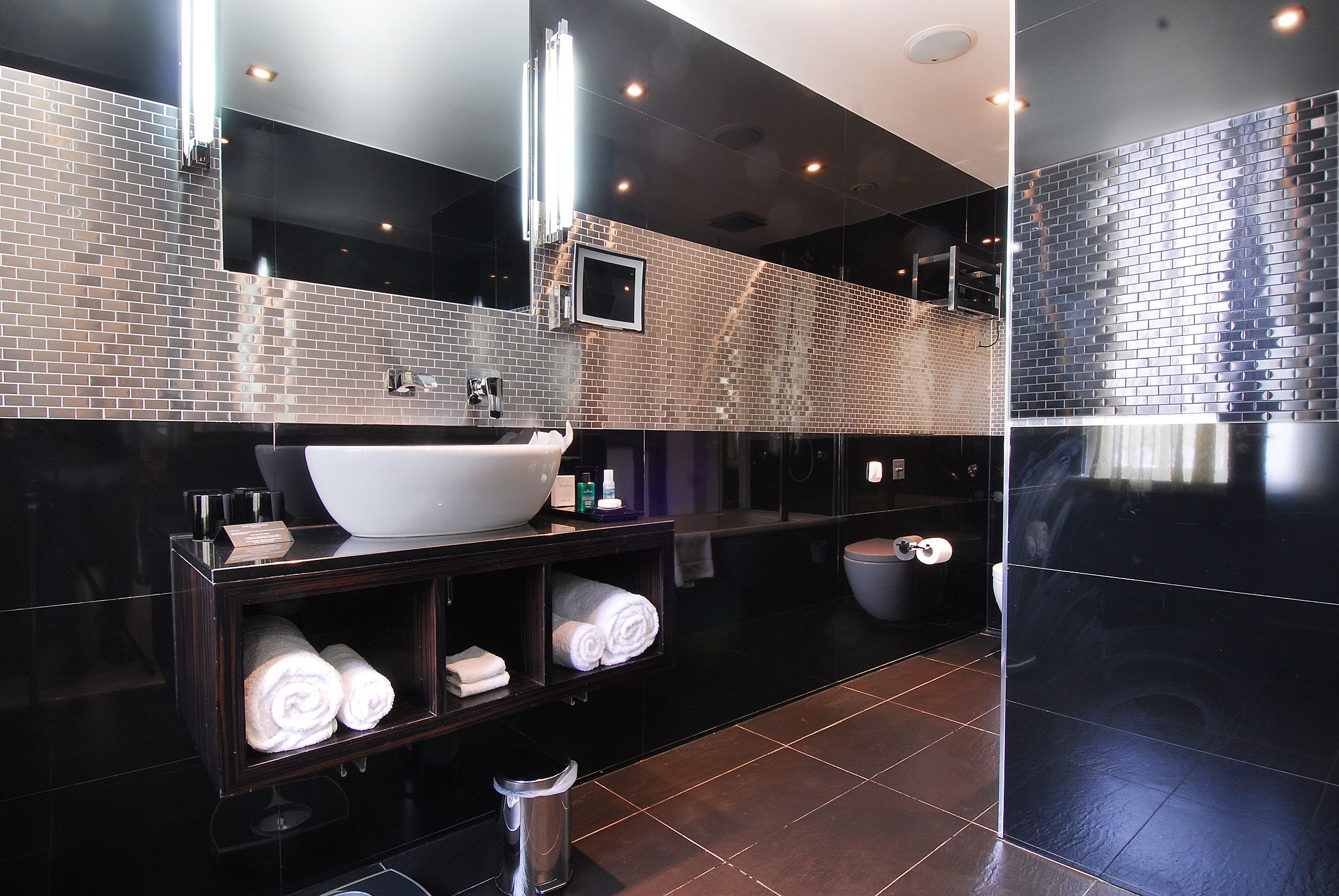 Combined shower/bathtub, designer toiletries, bathrobes, slippers