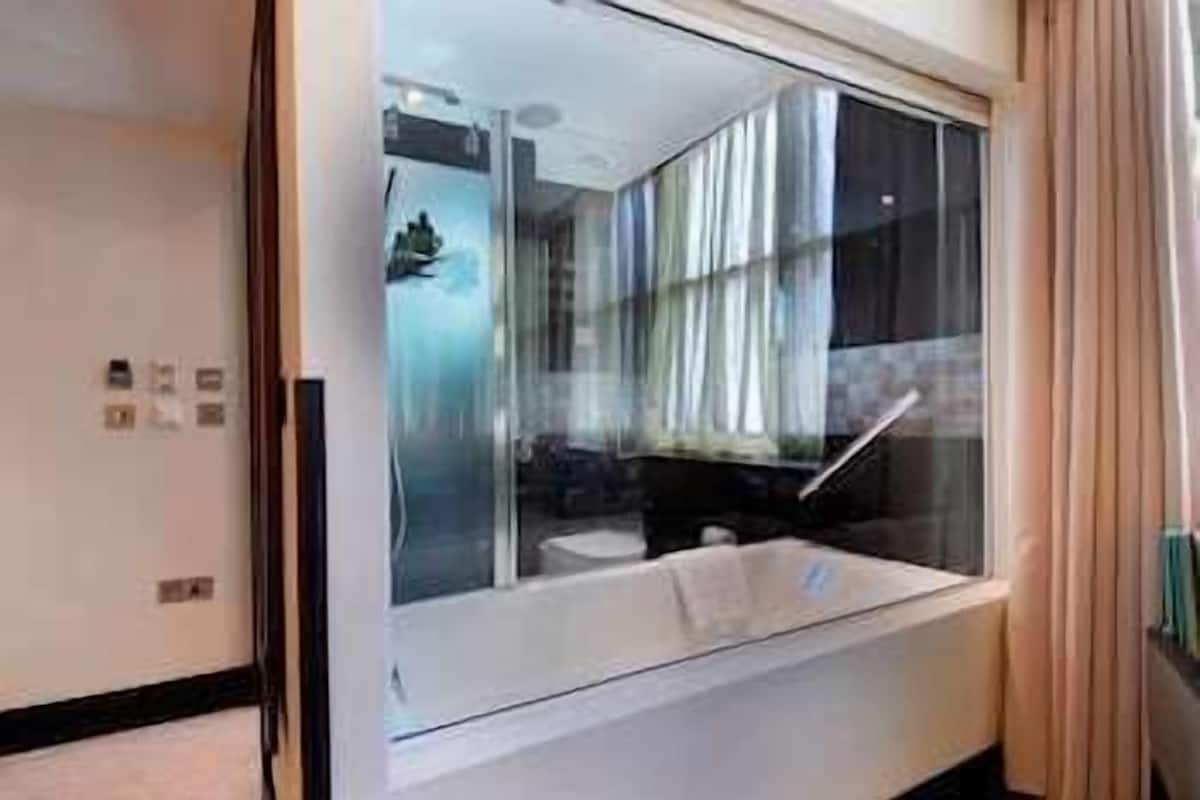 Bathroom | Combined shower/tub, designer toiletries, bathrobes, slippers