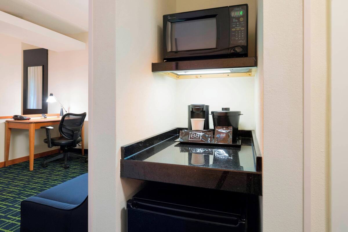 desk, blackout curtains, iron/ironing board, free cots/infant beds