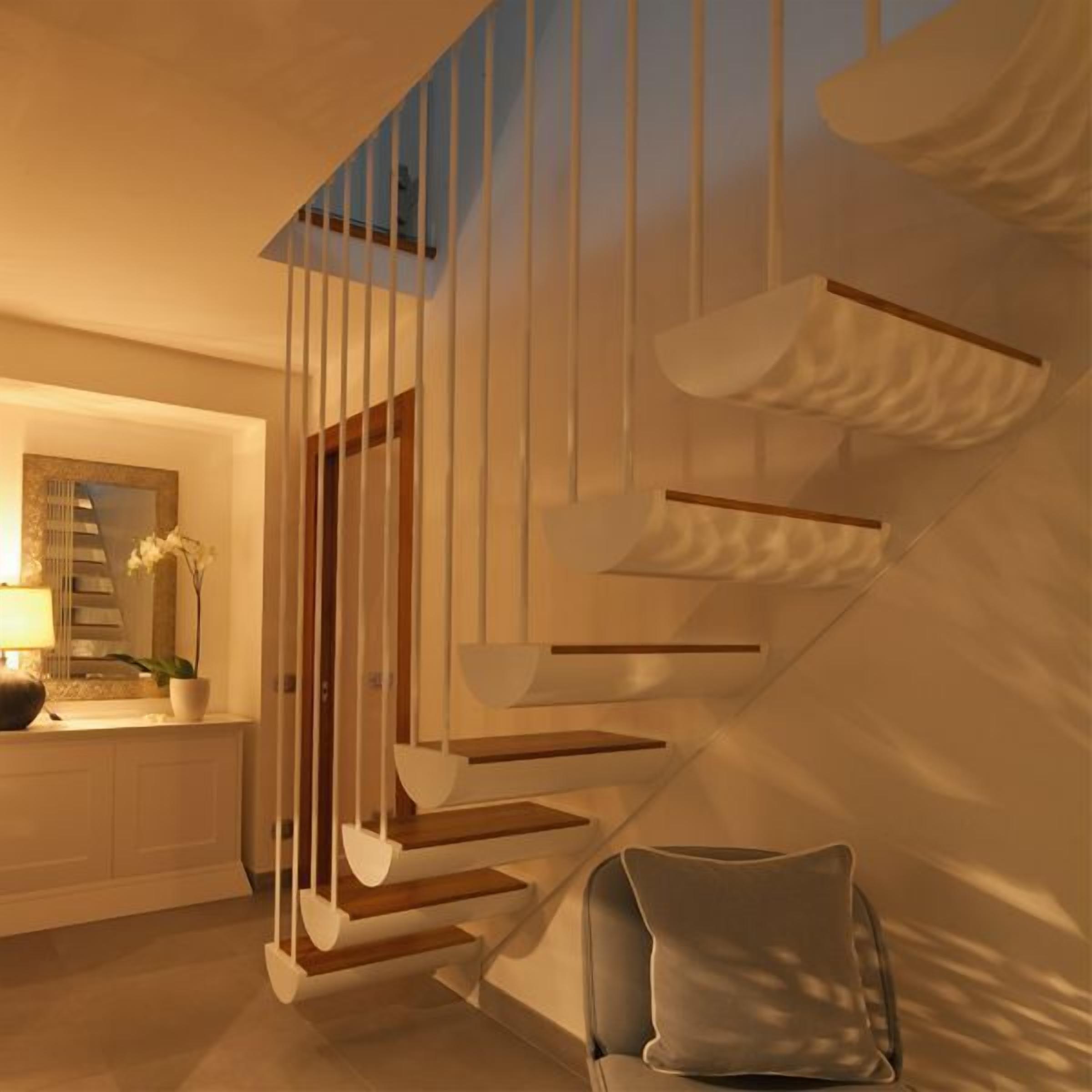 A modern staircase with white railings and wooden steps, leading to an upper floor.