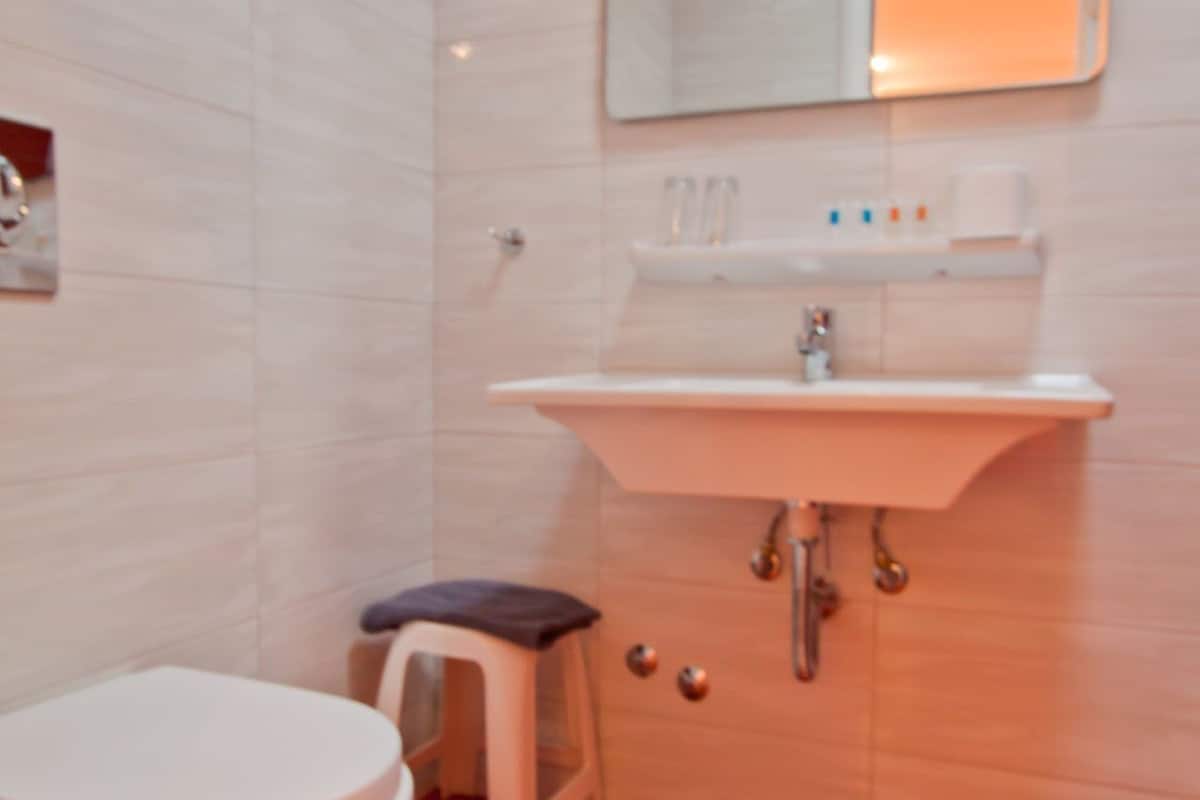 standard room | bathroom | shower, hair dryer, towels, soap