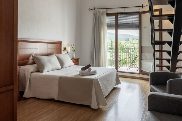 Premium bedding, memory-foam beds, desk, laptop workspace