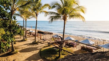 On the beach, white sand, free beach cabanas, sun-loungers