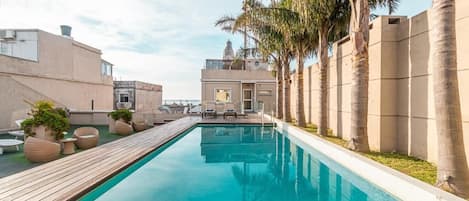 Outdoor pool, open 8 AM to 11 PM, pool loungers