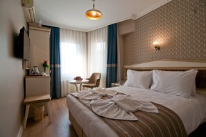 Luxe beddengoed, een minibar, een kluis op de kamer, een bureau