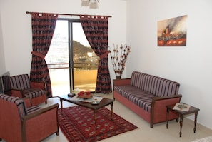 Junior Suite | Sala de estar | Smart TV