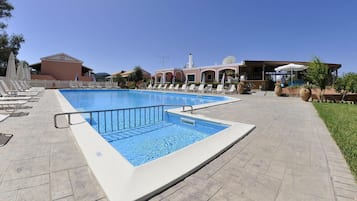 Seasonal outdoor pool, pool umbrellas, pool loungers