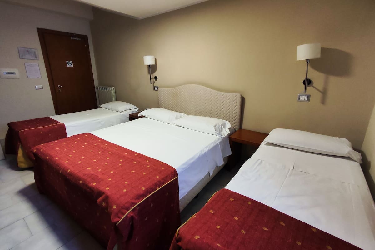 Superior Quadruple Room | Minibar, in-room safe, desk, iron/ironing board